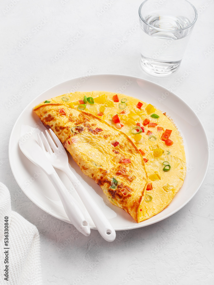 omelette with tomato, bell pepper onion and cheese. healthy breakfast omelette with tomato, bell pepper onion and cheese. healthy breakfast