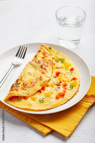 omelette with tomato, bell pepper onion and cheese. healthy breakfast