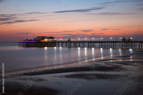 Pier with attraction in the evening after sunset in Blackpool beach. England  UK