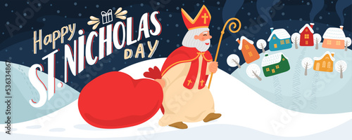 Happy Saint Nicholas Day. St. Nicolas carries gift bag in winter village with hand drawn greeting lettering.