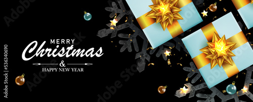 Christmas holiday composition with gift boxes, golden glittering bows and tinsel