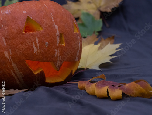 Pumpkin, close-up of dirty Jack-o-lantern. Orange decorative pumpkin. Halloween party concept.