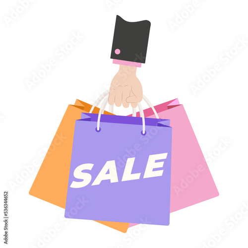 Hand holding colorful Shopping or gift Bags. Sale sign. Shopping bags.
