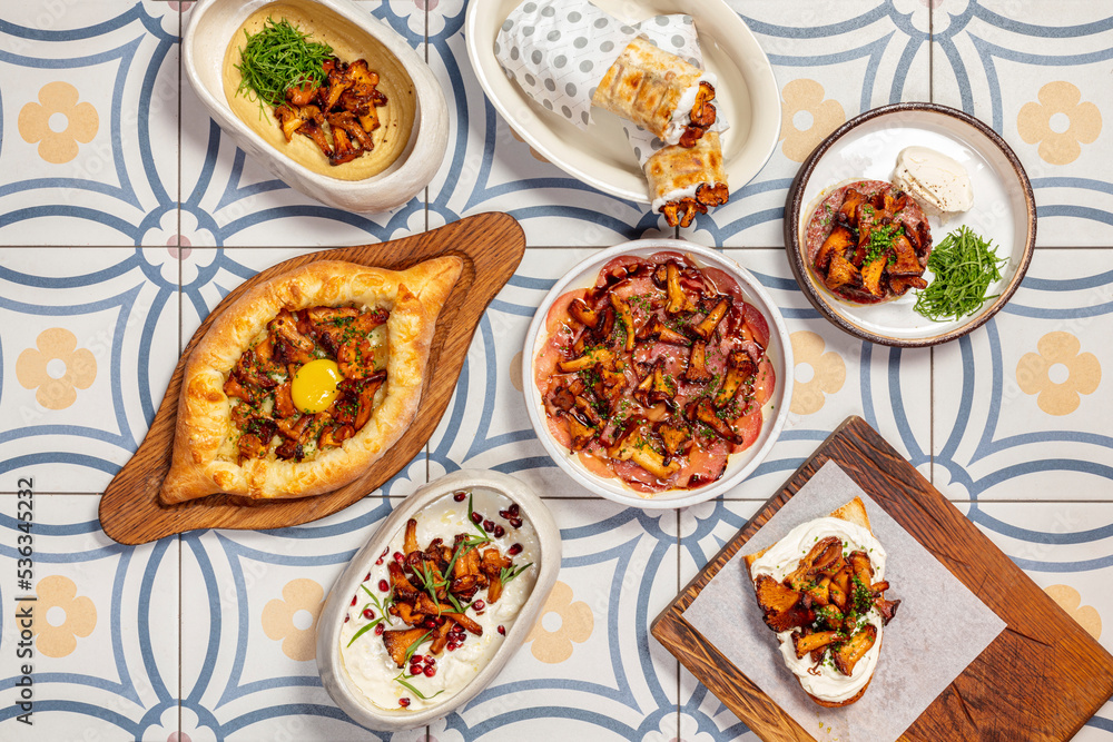 Assorted Caucasian dishes with fried chanterelle mushrooms Assorted Caucasian dishes with fried chanterelle mushrooms