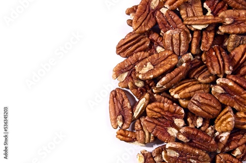 Shelled pecans to the right of white