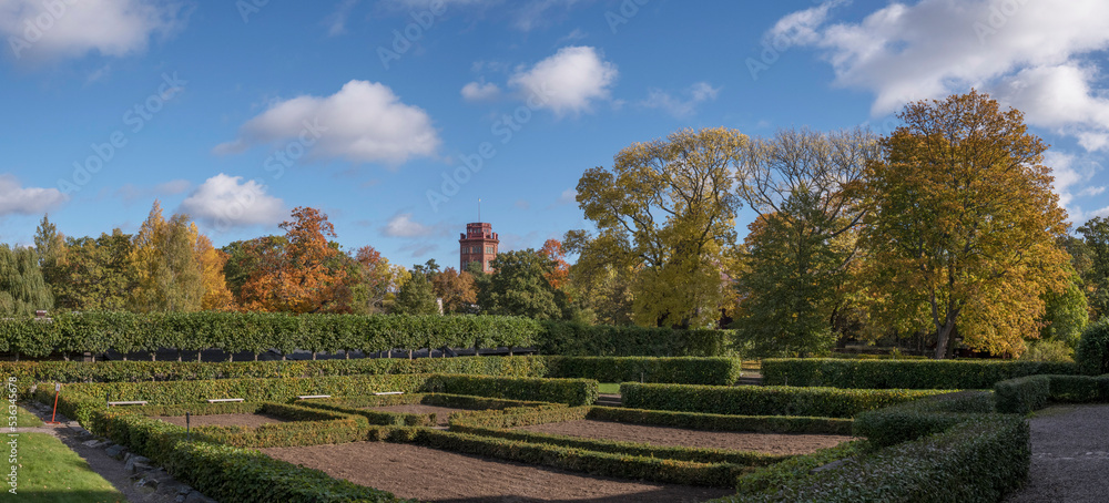 Back side garden and the tower Bredablick in a park a colorful sunny autumn day in Stockholm