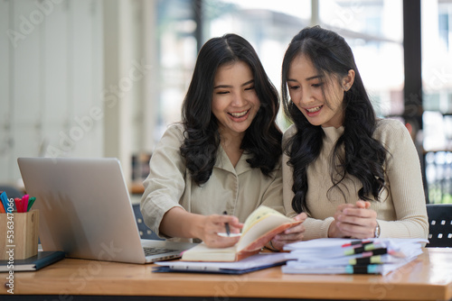 Young business team working with business report document on office desk. Brainstorming Business People Design Planning, Brainstorming Planning Partnership. © Songsak C
