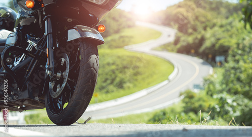 Classic american motorcycle. motorcycle in a sunny motorbike on the road riding.with sunset light. copy space for your individual text.On the road. Wheel bike.