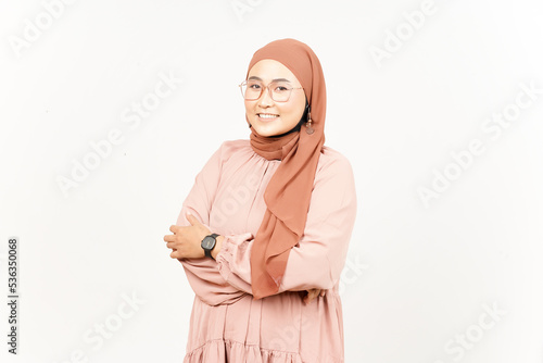 Smiling Folding hands and looking at camera of Beautiful Asian Woman Wearing Hijab