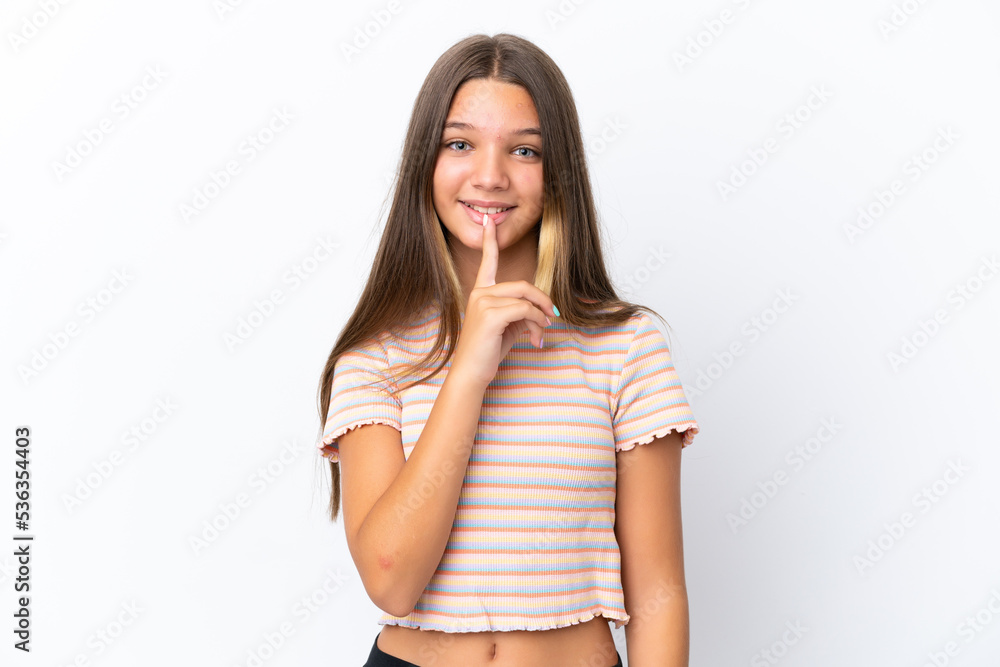 Little caucasian girl isolated on white background showing a sign of silence gesture putting finger in mouth Little caucasian girl isolated on white background showing a sign of silence gesture putting finger in mouth