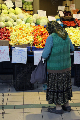 An Old woman doing shopping at market