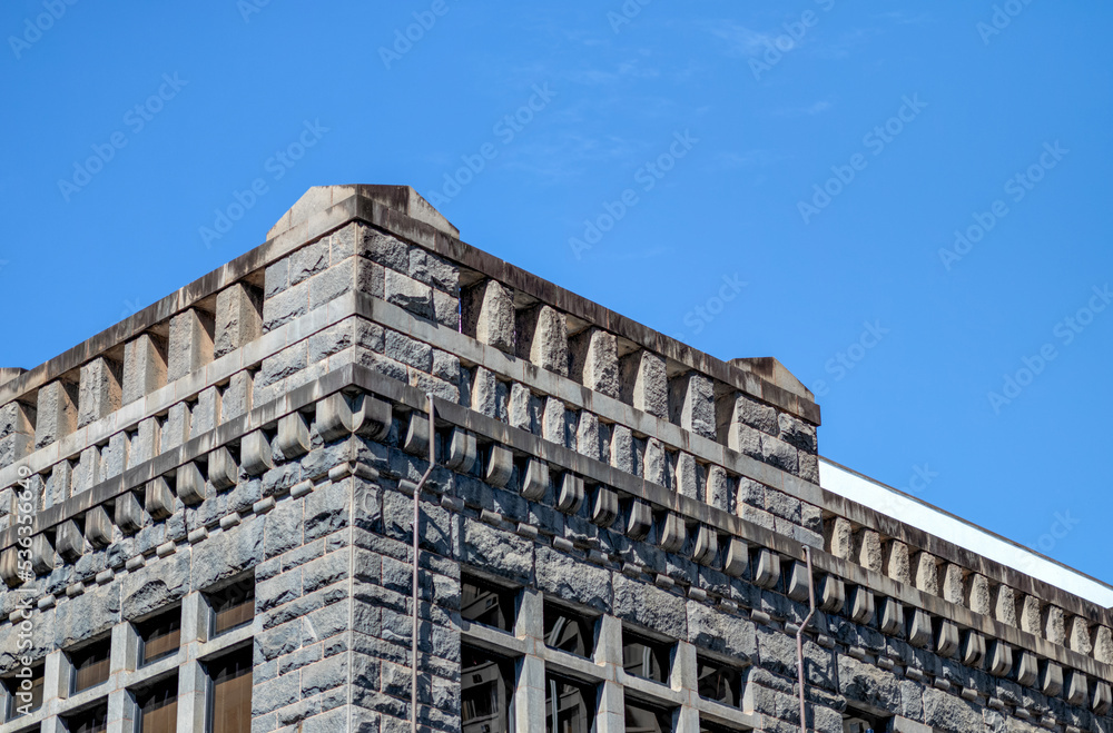 Charcoal Gray Fortress Building Under Blue Sky.