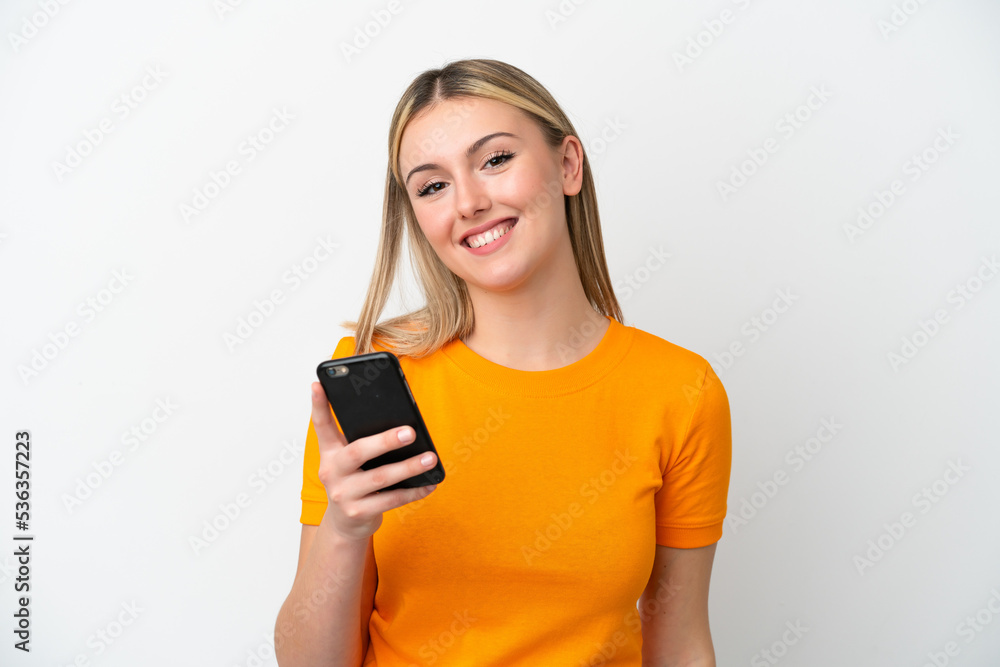 Young caucasian woman isolated on white background using mobile phone Young caucasian woman isolated on white background using mobile phone
