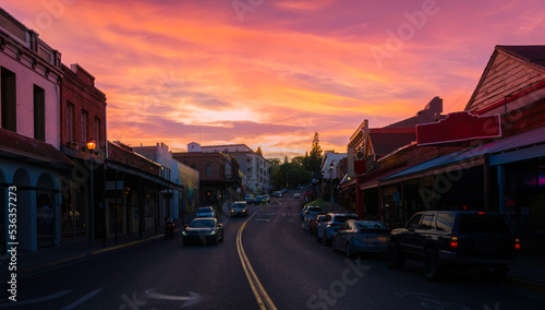 Sunset over a small western town and curved street in autumn © Naya Na
