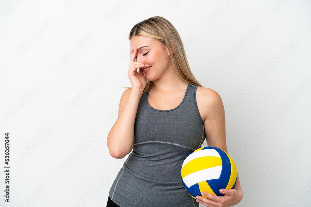 Young caucasian woman playing volleyball isolated on white background laughing Young caucasian woman playing volleyball isolated on white background laughing