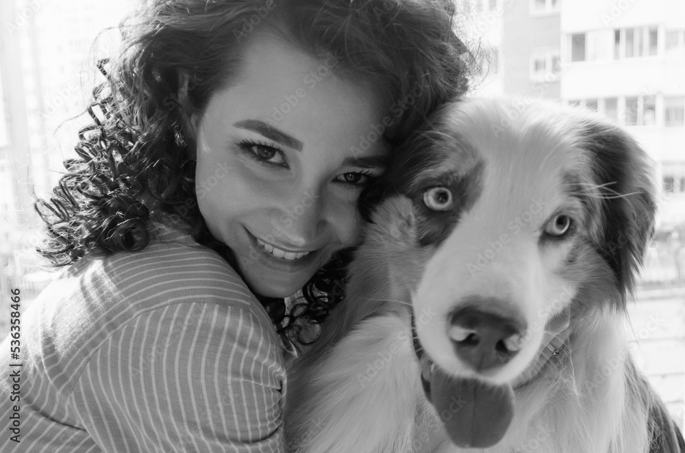 young Woman and Australian Shepherd Dog young Woman and Australian Shepherd Dog