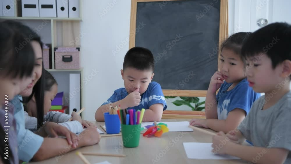 Educational concept of 4k Resolution. Kindergarten children drawing fun in the classroom. Educational concept of 4k Resolution. Kindergarten children drawing fun in the classroom.