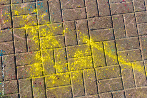 Multi-colored earth, paving slabs, powder coated with colors at the festival.