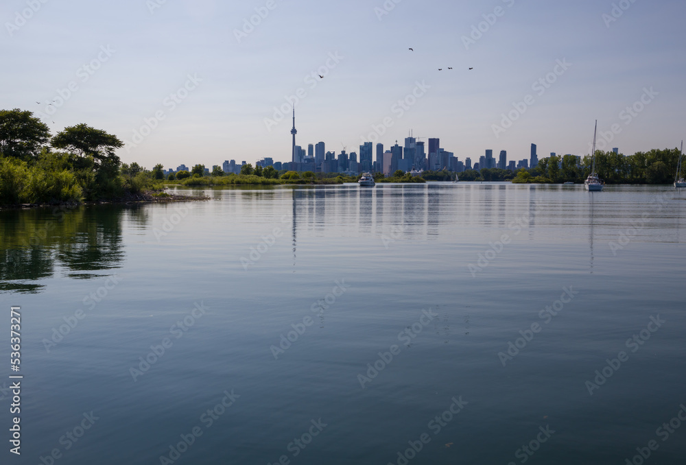 City skyscraper view cityscape background skyline silhouette, lake water and forest with copy space