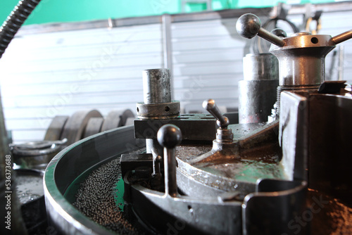 Bearings in production.Old equipment. Small diameter bearings. The concept of the industrial industry.Heavy industry. Photo in real factory.Selective focus.