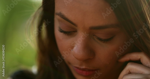 Pensive thoughtful latina young woman looking up thinking2