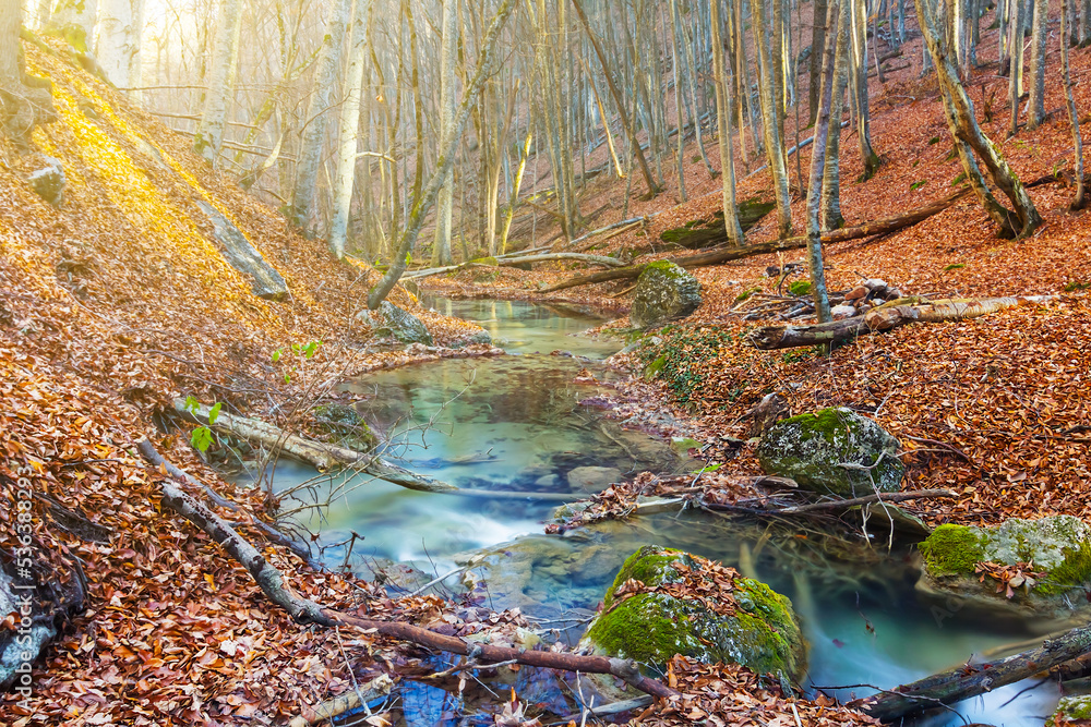 small waterfall on mountain river flow through autumn mountain canyon small waterfall on mountain river flow through autumn mountain canyon