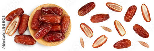 Dates in wooden bowl isolated on white background. Top view. Flat lay