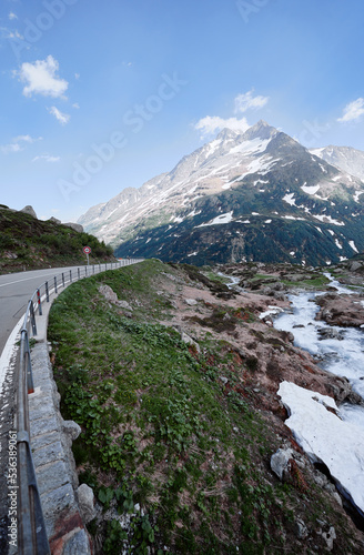 Travel by Switzerland. Beautiful summer Alpine mountains landscape with snow.