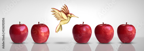 Photos Metaphor for new idea and creative thinking as a symbol of innovation and inspiration concept as a group of red apples as one different apple transforming into a fruit sculpture of a bird in flight