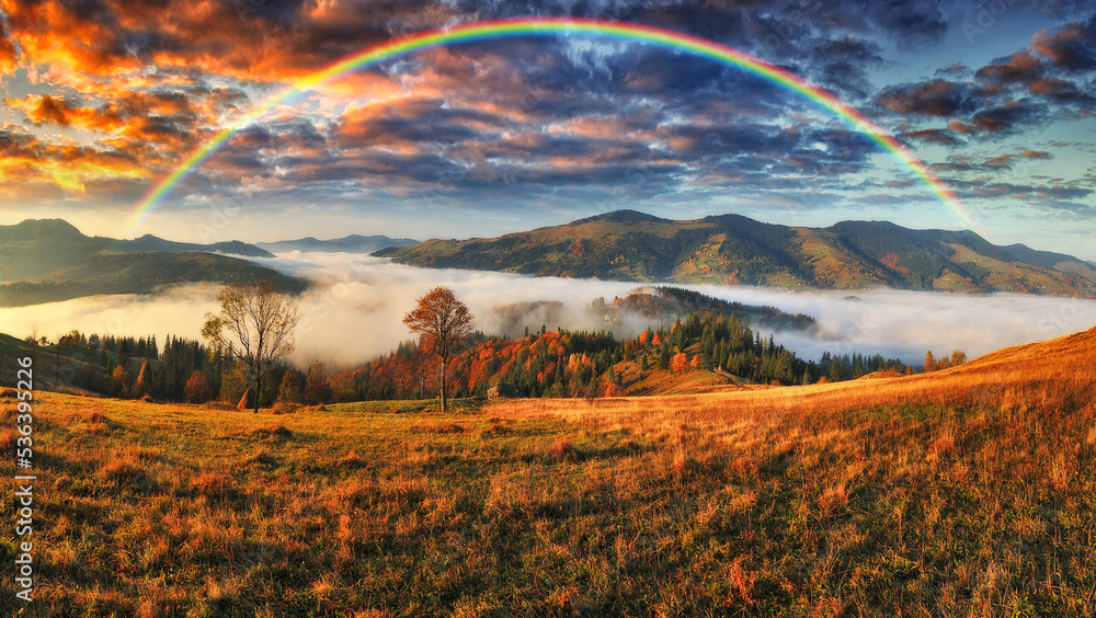 Obraz premium Rainbow over the Mountains. autumn morning in the Carpathians. Nature of Ukraine