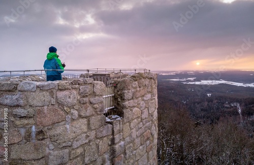 Man enjoying scenic sunset from Weissenstein ruined rock castle in Regen, Germany photo