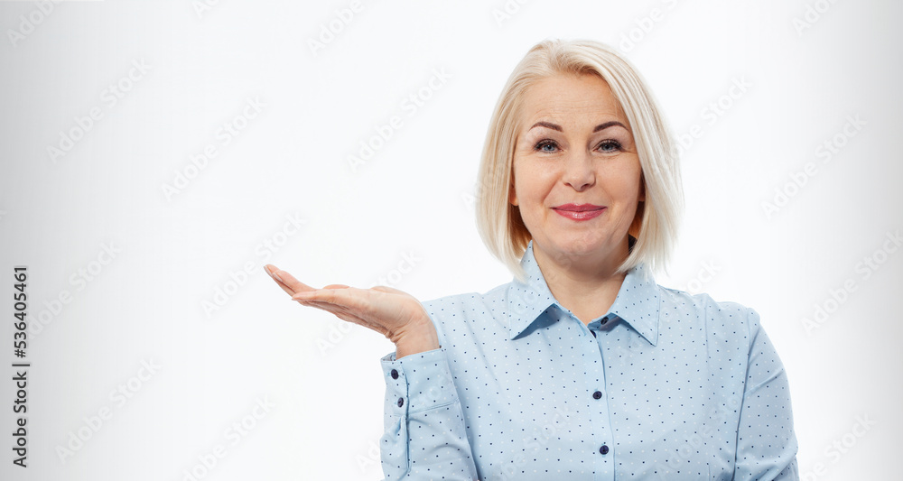 Photo of happy woman standing isolated over white wall background. Looking camera showing copyspace pointing. Photo of happy woman standing isolated over white wall background. Looking camera showing copyspace pointing.