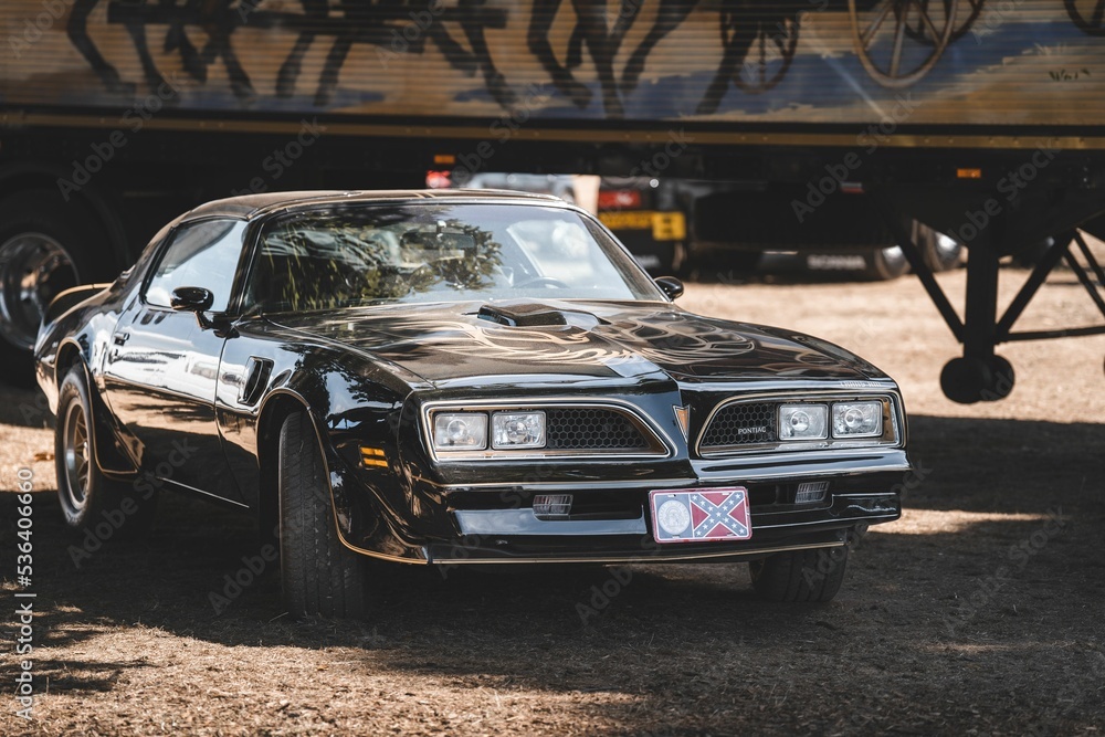 Black trans-am with a gold eagle on the hood Stock Photo | Adobe Stock