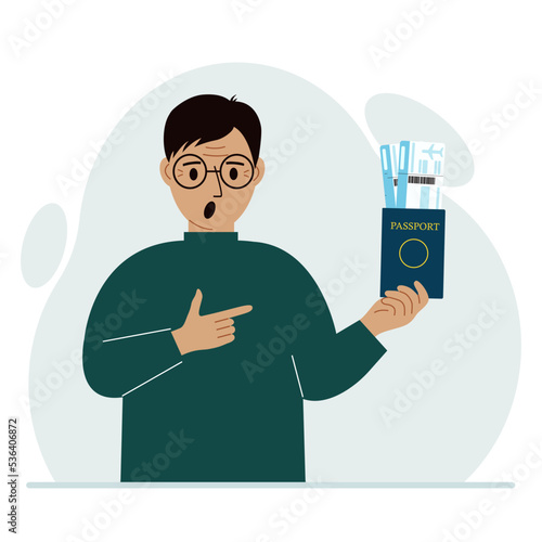 A man holds a passport with air tickets. The man shows the boarding pass. Travel concept.