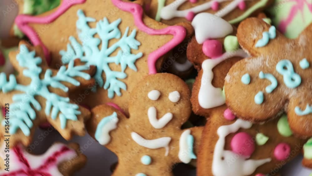 Decorated gingerbreads prepared for making holiday spirit and using on Christmas Day. Handmade cookies decorated with bright frosting icing cream toppings Decorated gingerbreads prepared for making holiday spirit and using on Christmas Day. Handmade cookies decorated with bright frosting icing cream toppings
