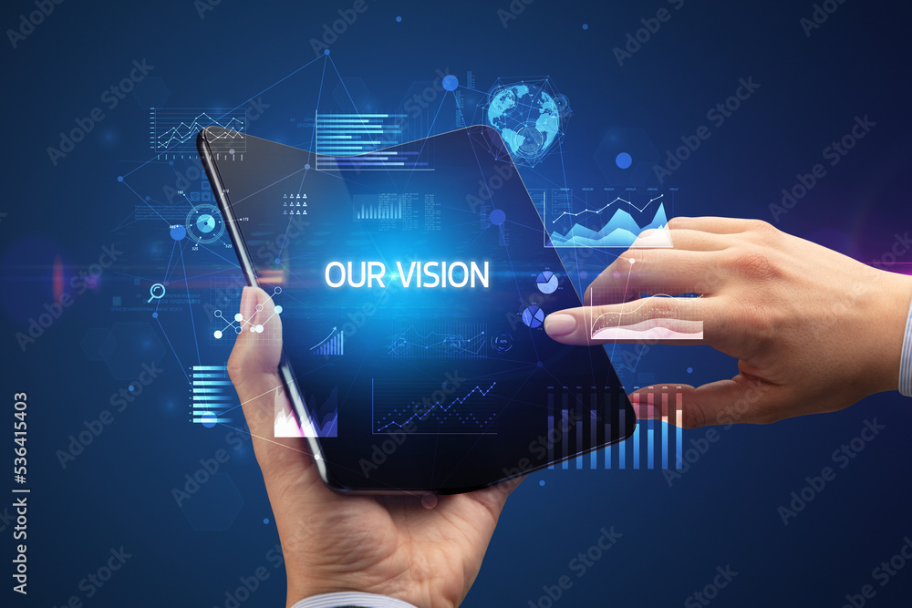 Businessman holding a foldable smartphone, business concept Businessman holding a foldable smartphone, business concept