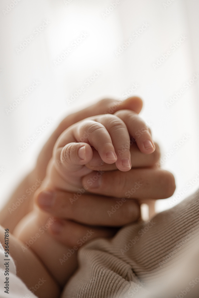 New born baby hand hold mum index finger. Mother and baby. New born baby hand hold mum index finger. Mother and baby.