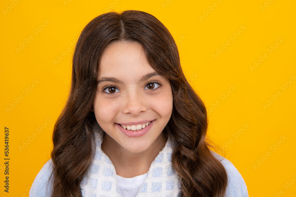 Portrait of beautiful happy smiling teenage girl on yellow studio background. Portrait of beautiful happy smiling teenage girl on yellow studio background.