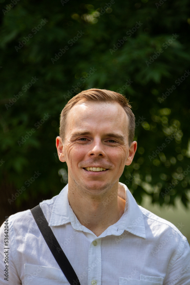 Young man having fun on a walk in the park Young man having fun on a walk in the park