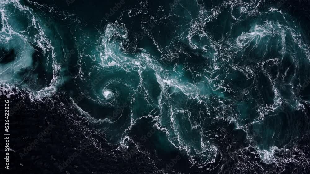 4K drone video with birds-eye view of the abstract and powerful water currents, rapids and whirlpools of the worlds larges maelstrom Saltstraumen, Norway. 4K drone video with birds-eye view of the abstract and powerful water currents, rapids and whirlpools of the worlds larges maelstrom Saltstraumen, Norway.
