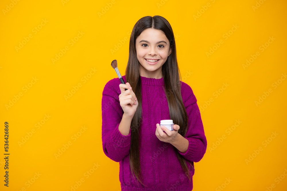 Child girl 12, 13, 14 years old making beauty make up with powder and brush. Beautiful teenager applying makeup. Child girl 12, 13, 14 years old making beauty make up with powder and brush. Beautiful teenager applying makeup.