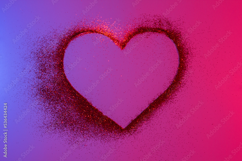 Heart of red bright sparkles in neon light. Shiny heart on a shiny background. Artistic design colorful and shiny bright background for holidays. Heart of red bright sparkles in neon light. Shiny heart on a shiny background. Artistic design colorful and shiny bright background for holidays.