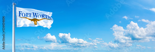 Fort Worth - USA, flag waving on a blue sky in beautiful clouds - Horizontal banner photo