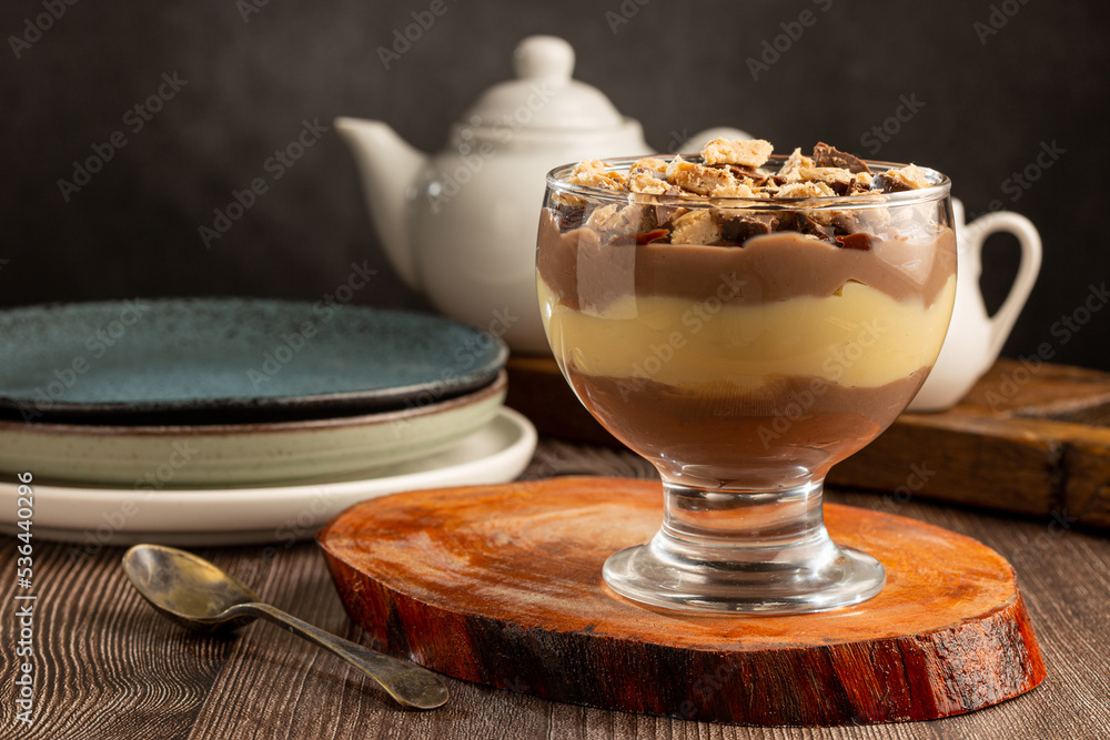 Obraz premium Dessert in the glass. Pastry cream dessert with chocolate ganache.