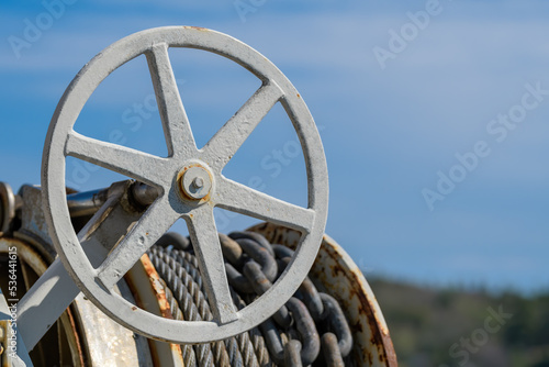 Hand wheel with anchor chain and cable.