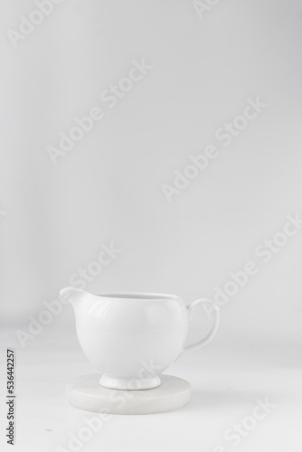 Ceramic milk jug, milk jug on a marble coaster