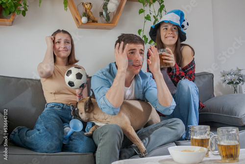 friends watching soccer in frustration and despair