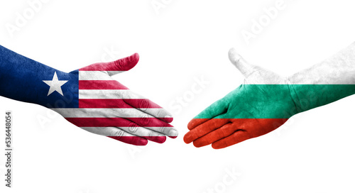 Handshake between Bulgaria and Liberia flags painted on hands, isolated transparent image.