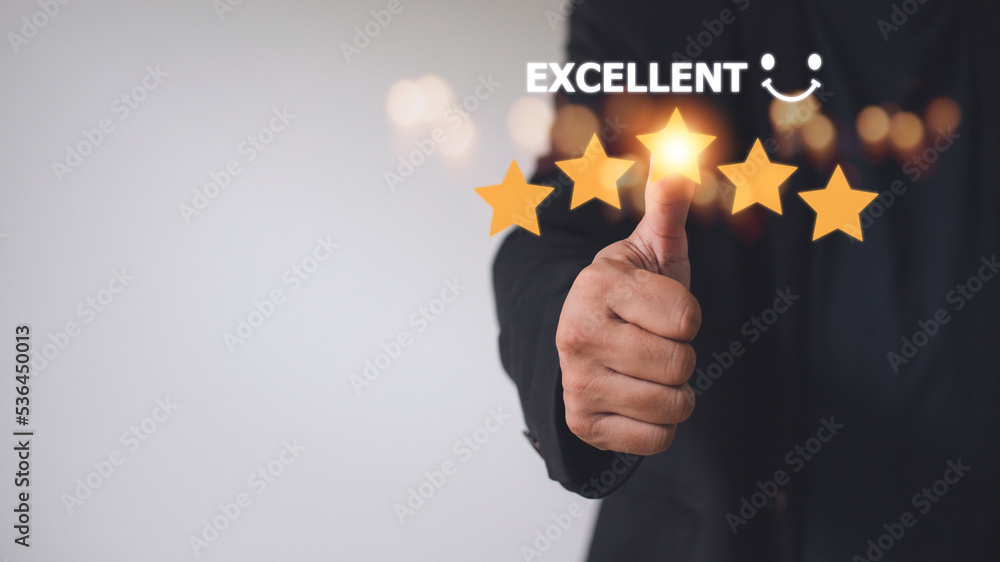 customer hand with gold five star rating feedback icon and press level excellent rank for giving best score point to review the service, business concept customer hand with gold five star rating feedback icon and press level excellent rank for giving best score point to review the service, business concept