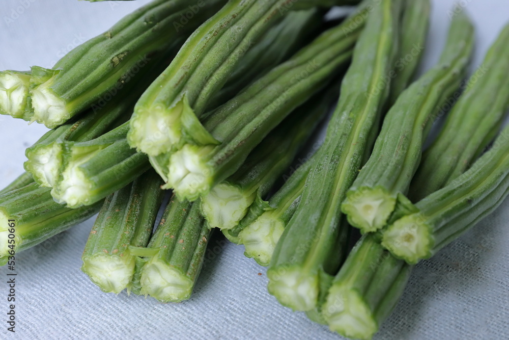Drumstick Vegetable or Moringa on display in white background Drumstick Vegetable or Moringa on display in white background
